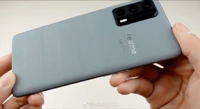 Realme X9 Pro Master Edition poses for the camera; shows off curved display
